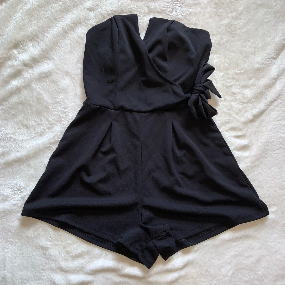 Francescas romper black side tie wrap around